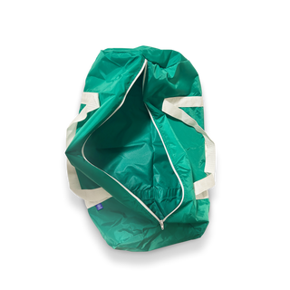 Green Track Star duffle bag laying open empty inside