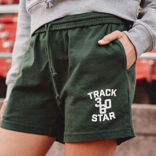 Woman wearing Track Star zoomed in on the logo