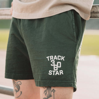 Man wearing Track Star shorts zoomed in on the logo