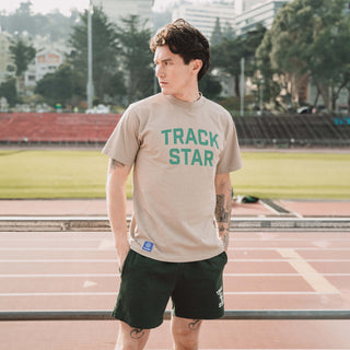 Man wearing the Track Star Shorts and Track Star Tee